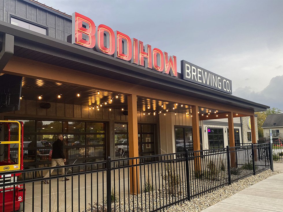 Exterior of Bodihow brewpub abd neon sign.