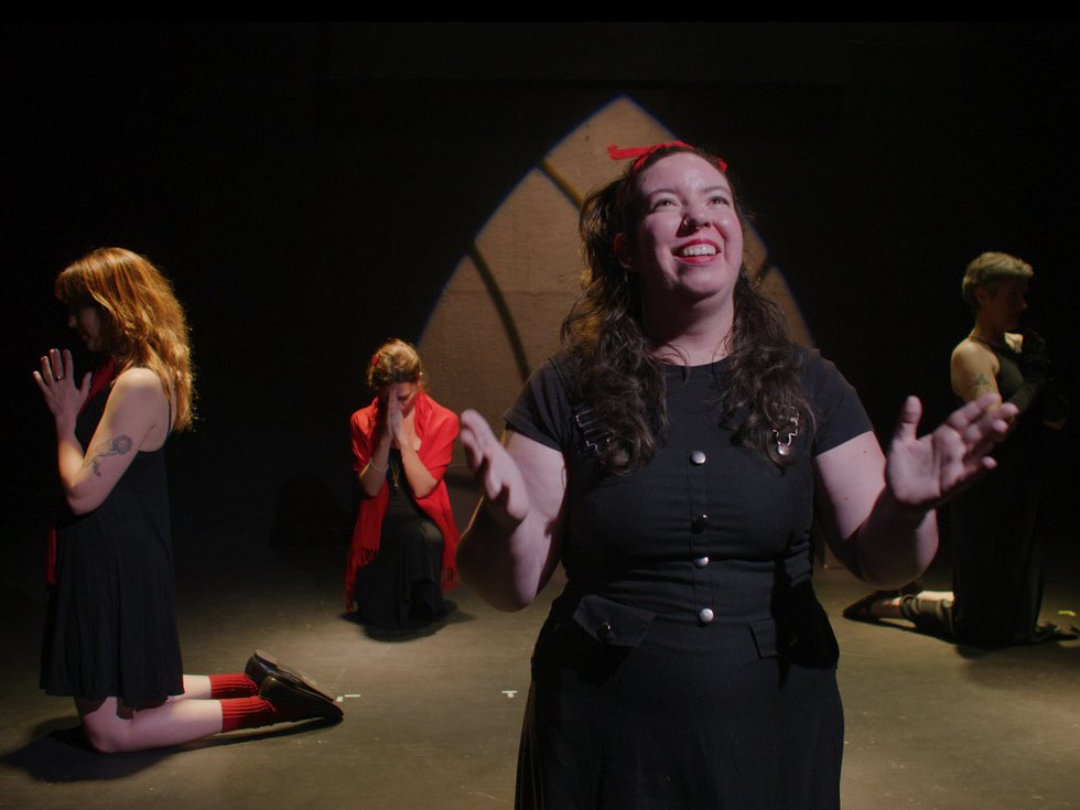 Charly Sparks, front, and cast members of "Aqua Tofana."
