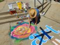 A sidewalk chalk artist during a past ArtJune event.