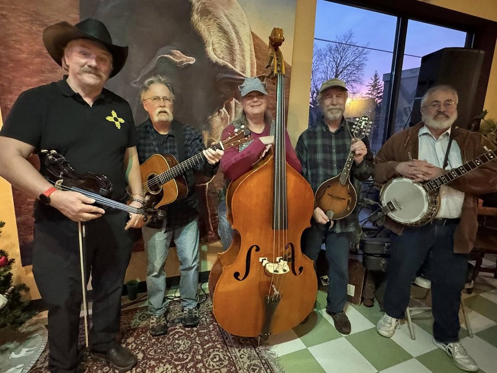 The five members of Down From the Hills and instruments.