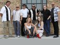 A band takes a moment for a photo.