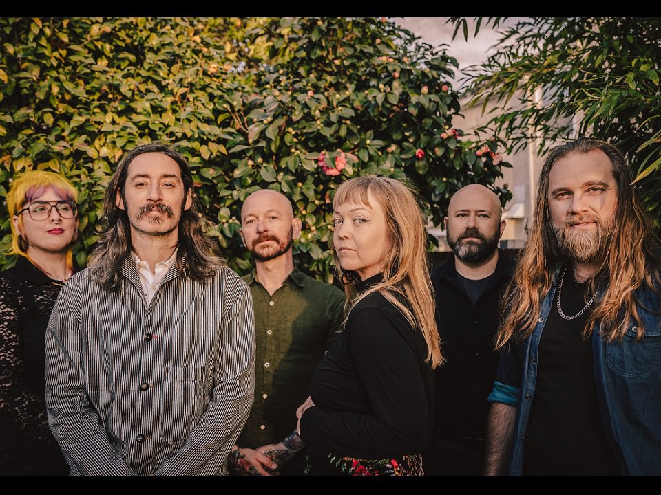 The six members of Murder By Death.