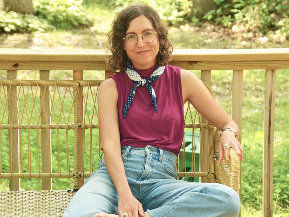 Denise S. Robbins sitting on a bench.