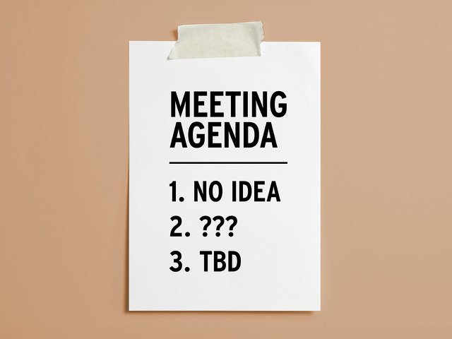 An empty meeting agenda taped to a wall.