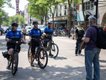A protester talks to bike cops at the No Kings protest on June 14, 2025.