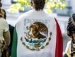 A protestor draped in a Mexican flag at the No Kings protest on June 14, 2025.