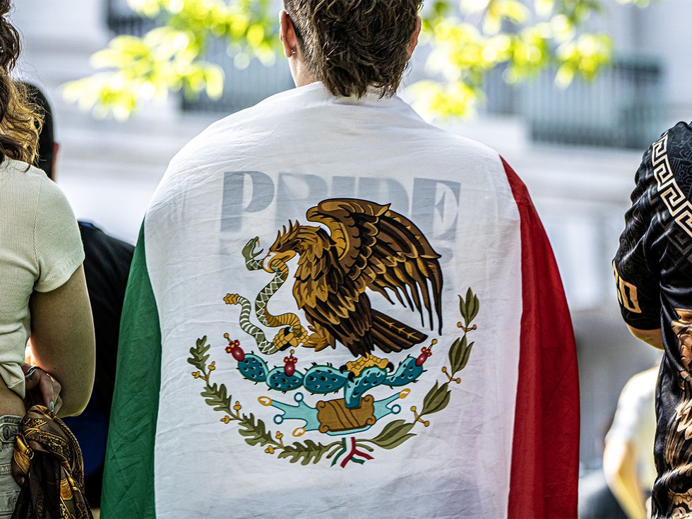 A protestor draped in a Mexican flag at the No Kings protest on June 14, 2025.