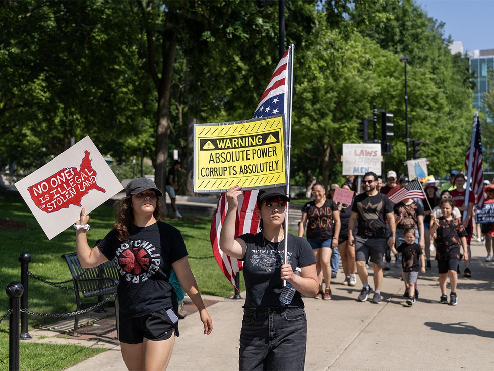 Examples of signs at the No Kings protest on June 14, 2025.