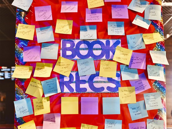 Lots of post-its on a recommendation board.